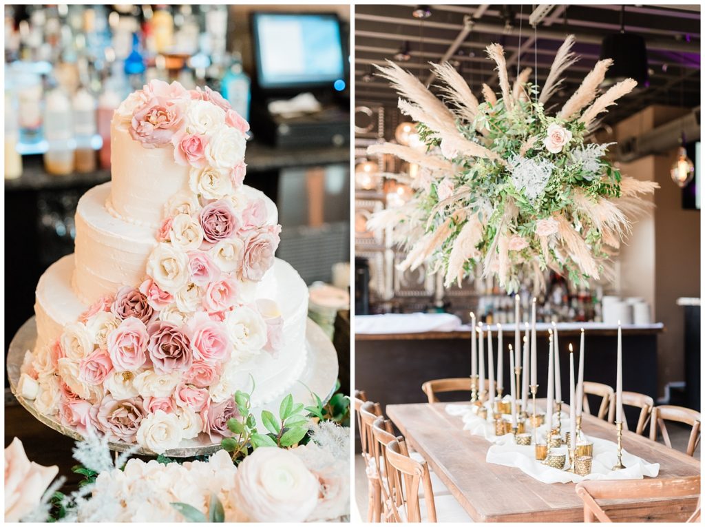 Candle sticks sit on the center of the table beneath a suspended floral arrangement at the wedding reception.