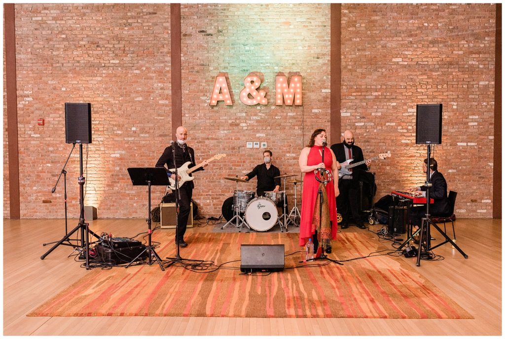 The band plays during the reception in Beacon NY at Roundhouse Hotel winter wedding inspiration.