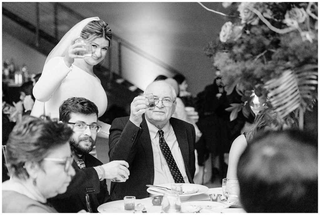 Bride toasts with her father in Beacon NY at Roundhouse Hotel winter wedding inspiration.