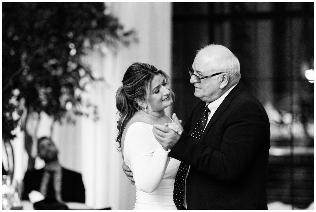 Father of the bride dances with his daughter at her winter wedding in Beacon NY at Roundhouse Hotel winter wedding inspiration.in Beacon NY at Roundhouse Hotel.