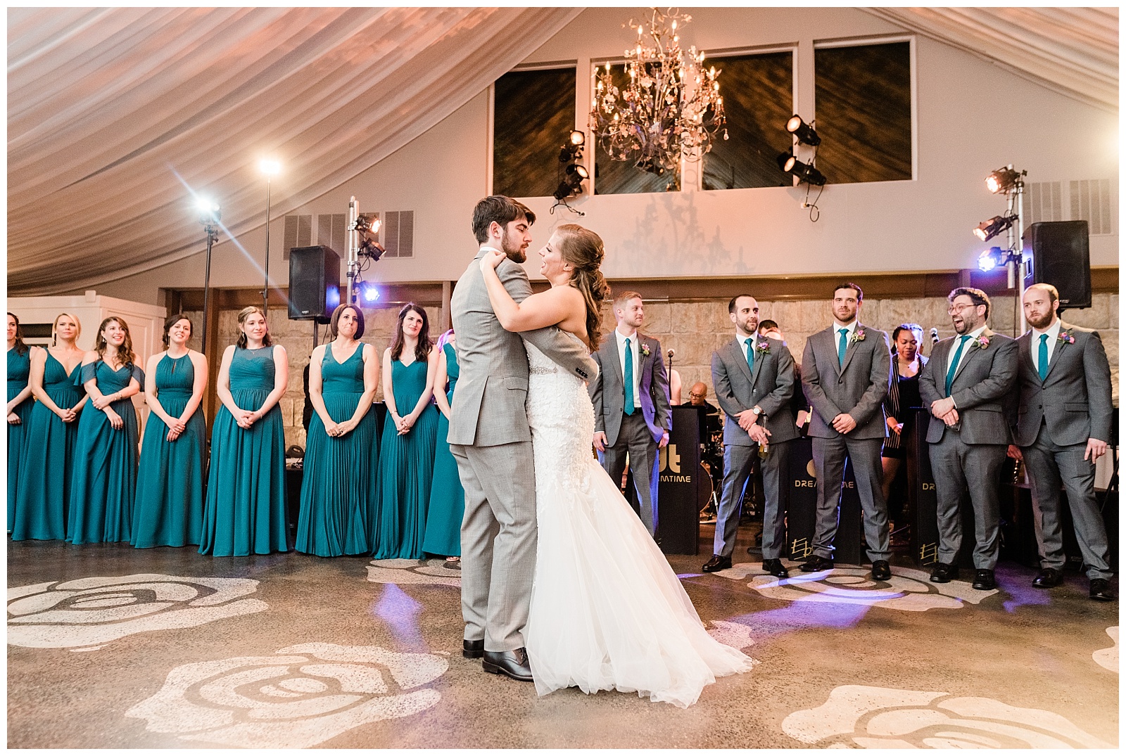 Bride and groom share a first dance on the dance floor of the ballroom at Lake House Inn.