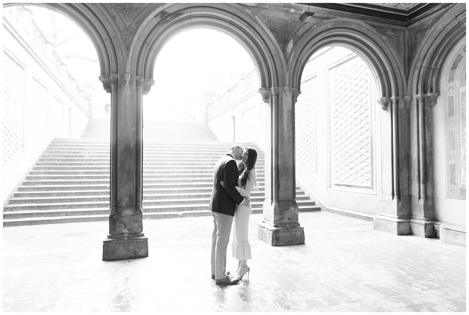 A couple shares a quiet moment alone in Bethesda Terrace.