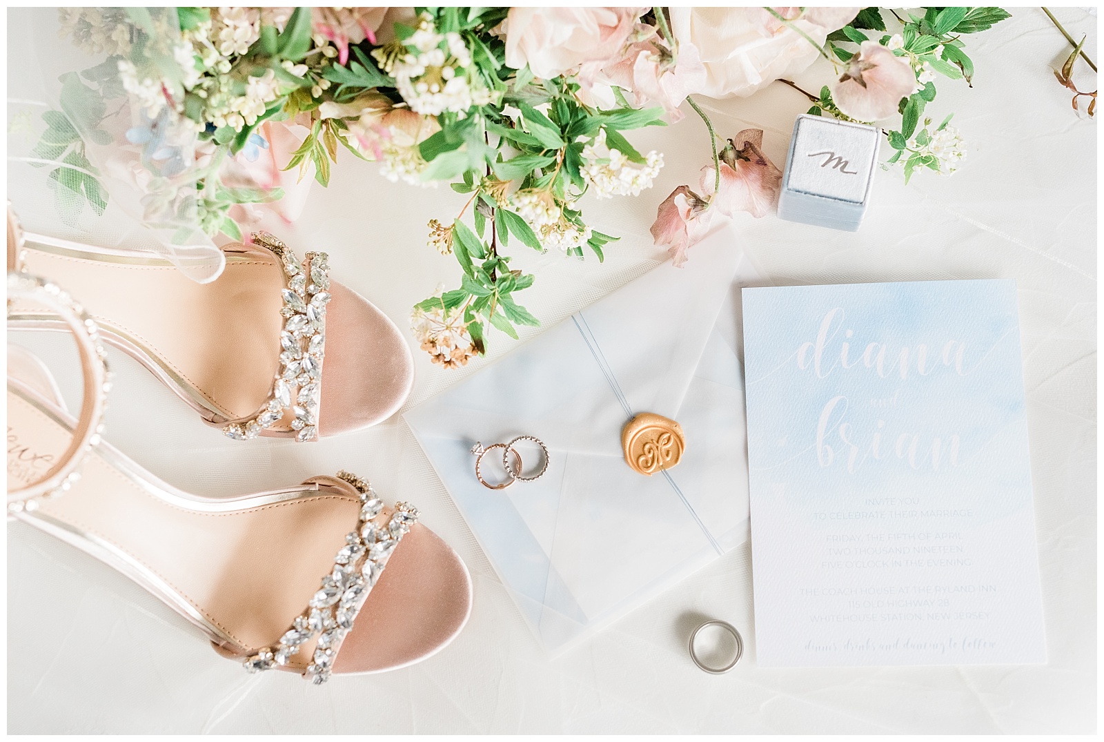 Blue watercolor invitation suite styled with shoes and bouquet.