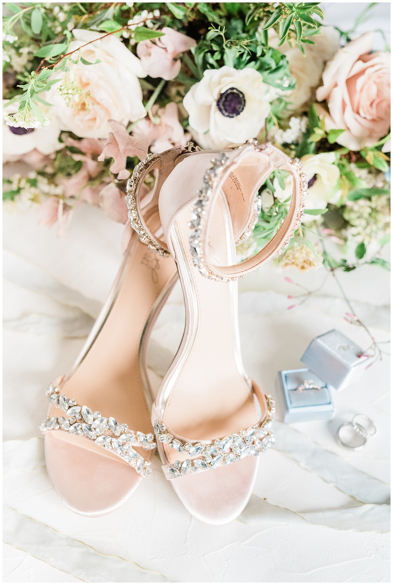 Badgley Mischka shoes styled with wedding rings and a bouquet.