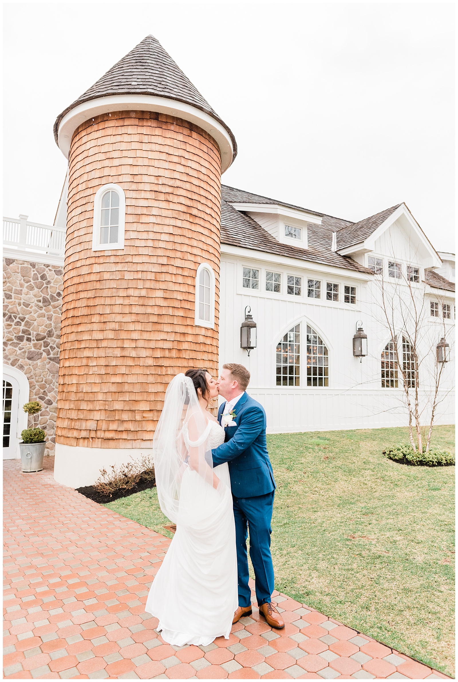 Bride and groom kiss outside the Coach House at the Ryland Inn, Whitehouse Station, NJ.