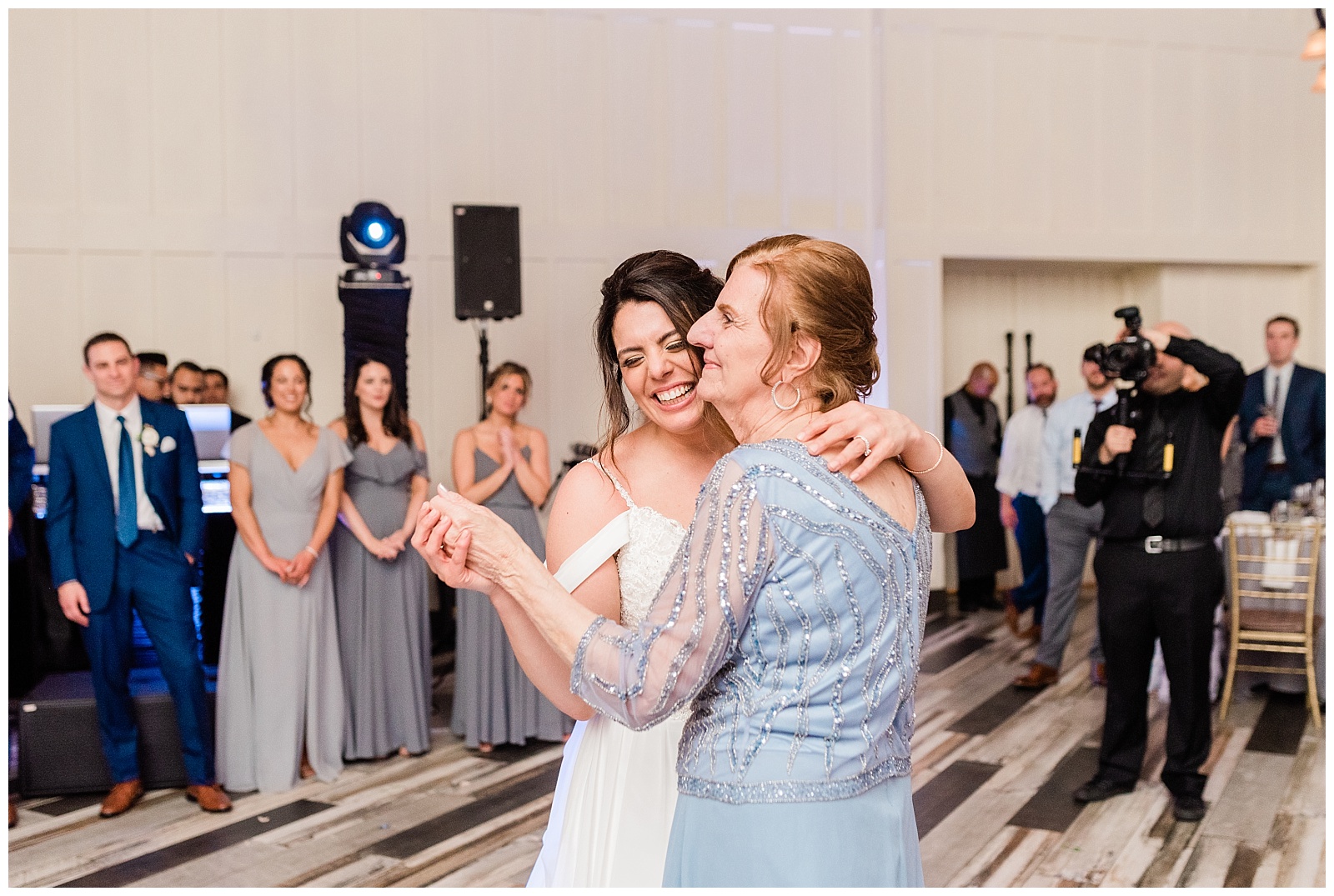 Bride dances with with her mother during parent dances in the reception.