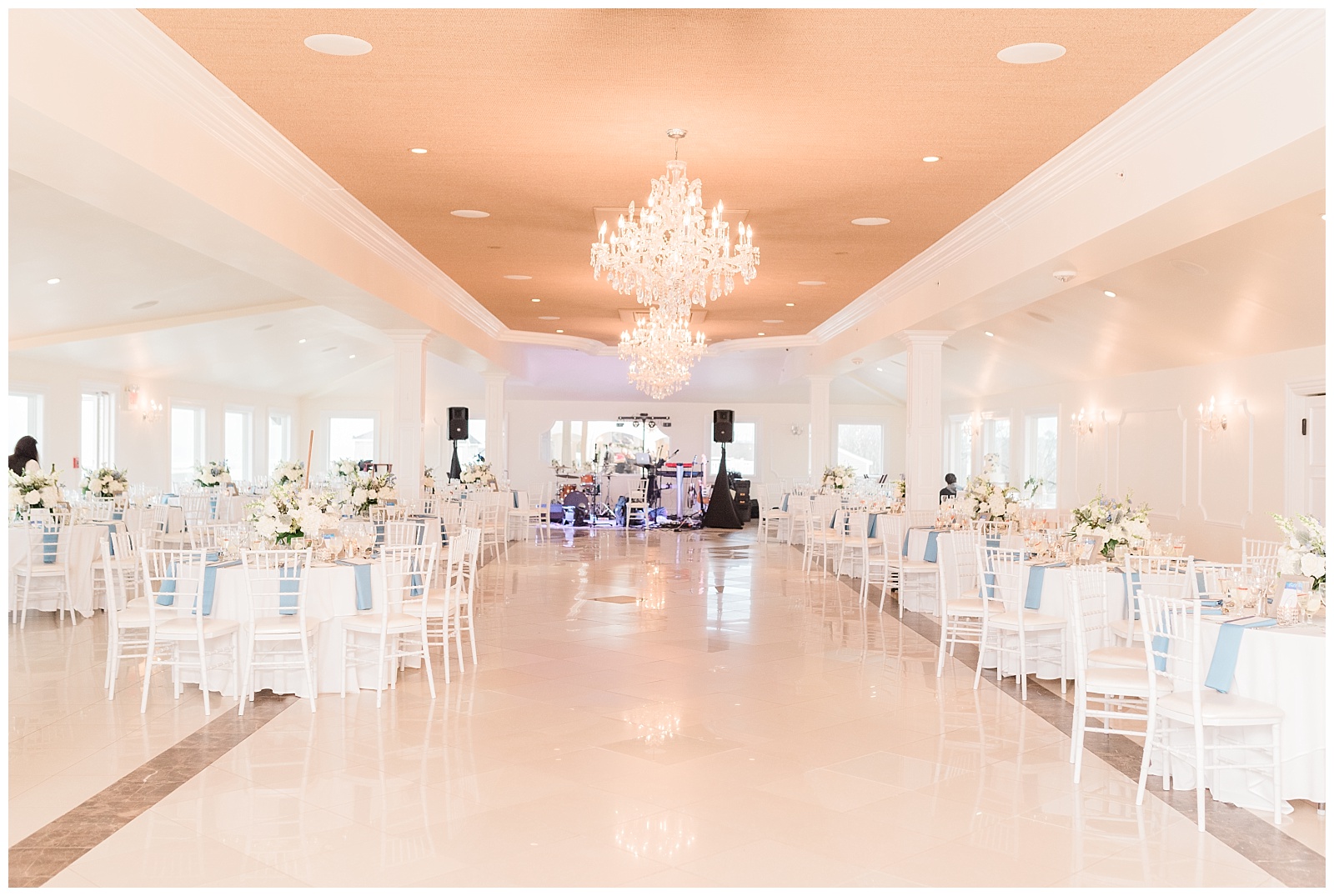 The ballroom of the Windows on the Water at Surfrider Beach Club is set for the reception.