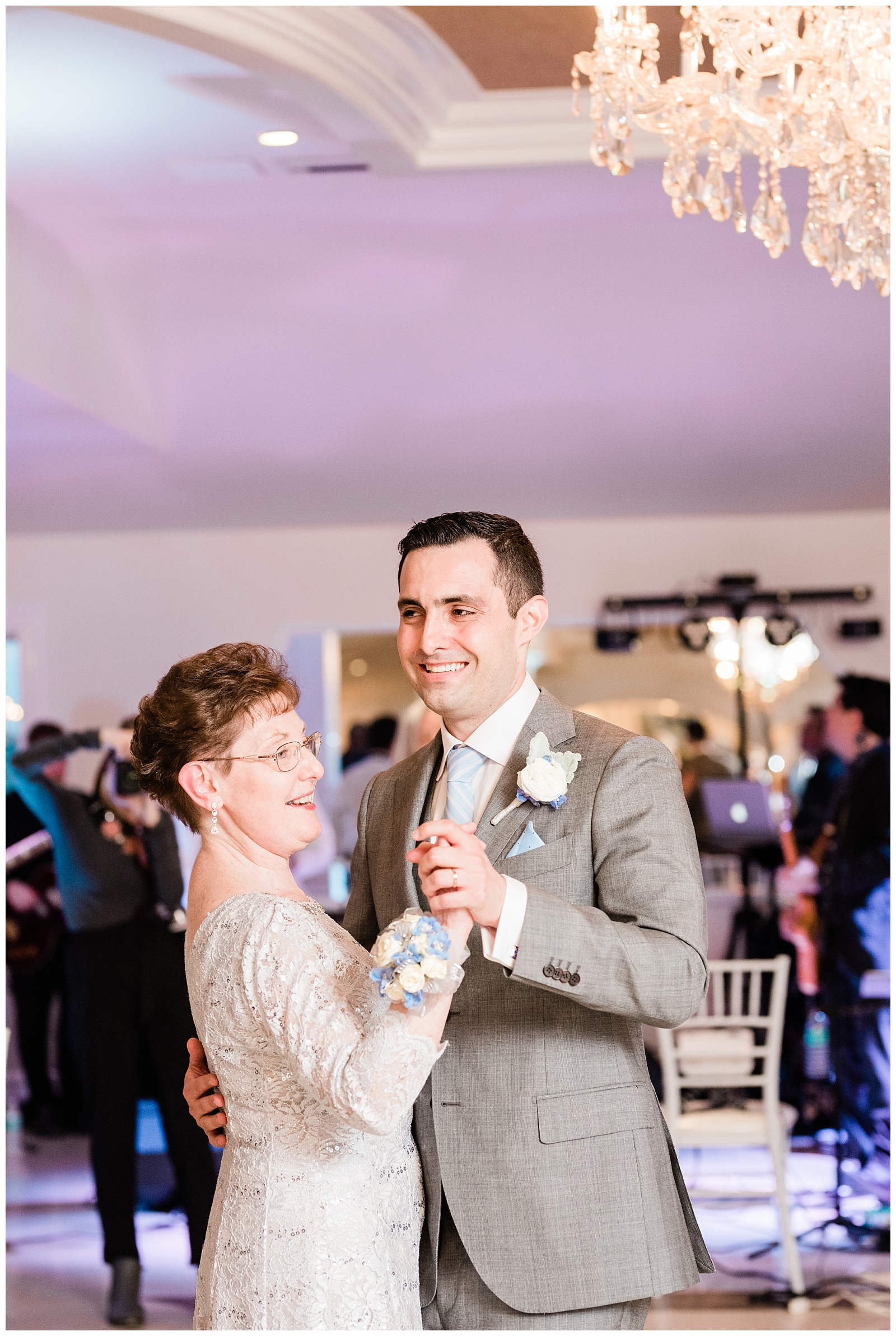 Groom dances with his mom during the wedding reception.