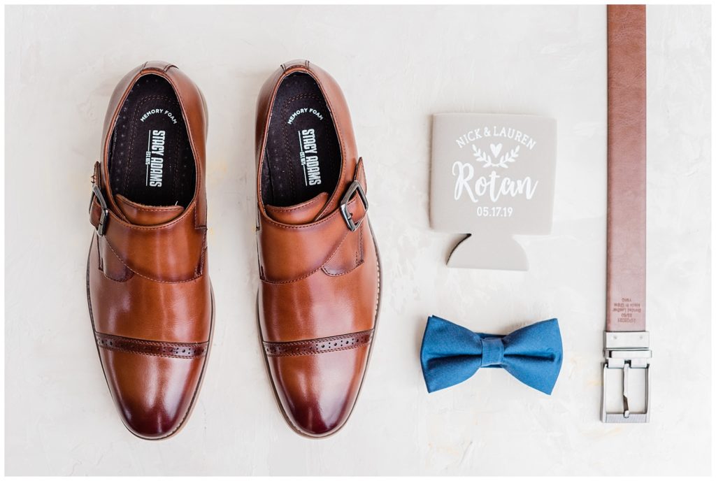 Groom's shoes, bow tie and belt are styled together.