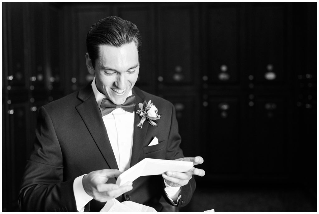 The groom reads a love note from the bride.