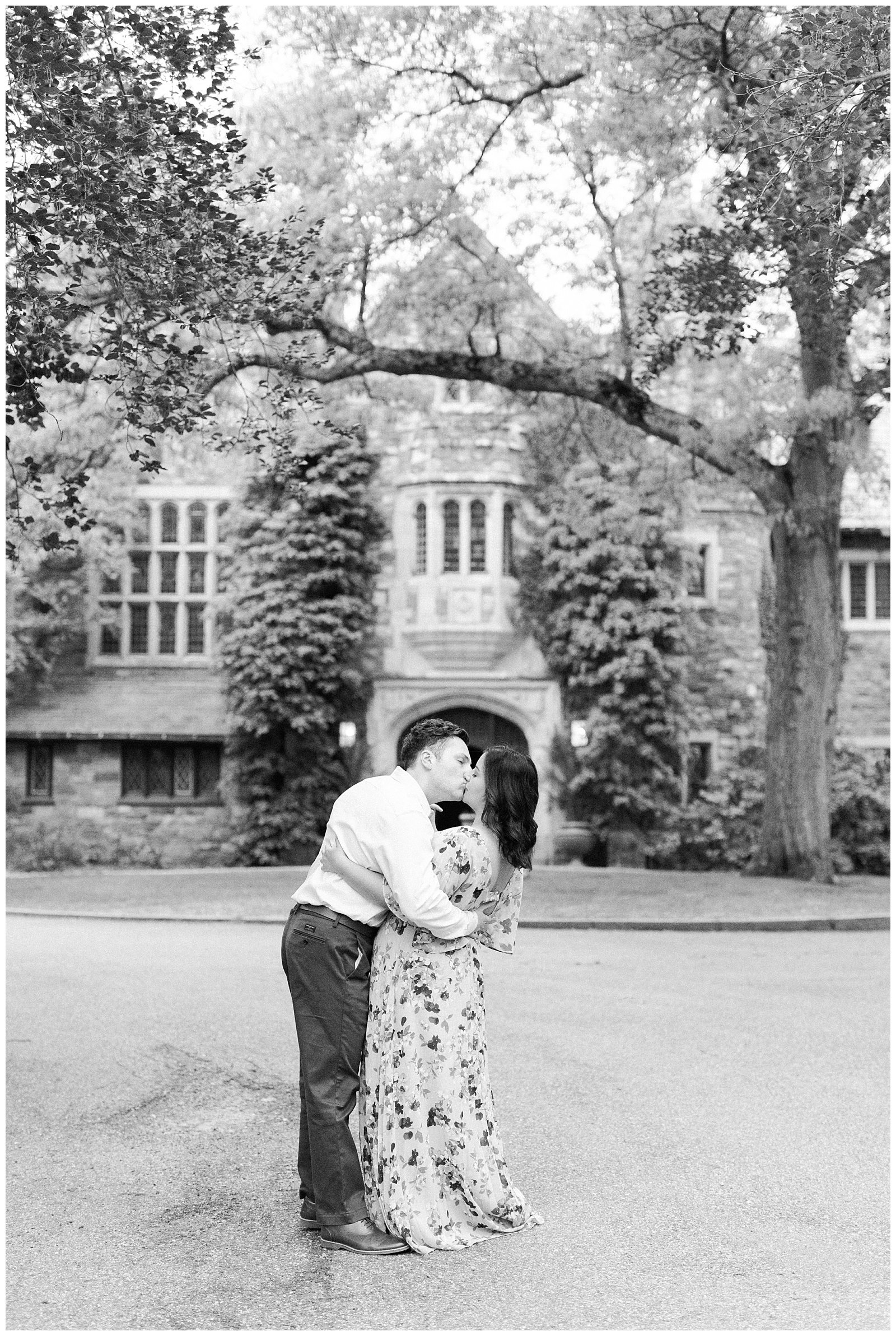 A man kisses his fiancee in front of the Skylands Manor in Ringwood Botanical Garden, NJ.