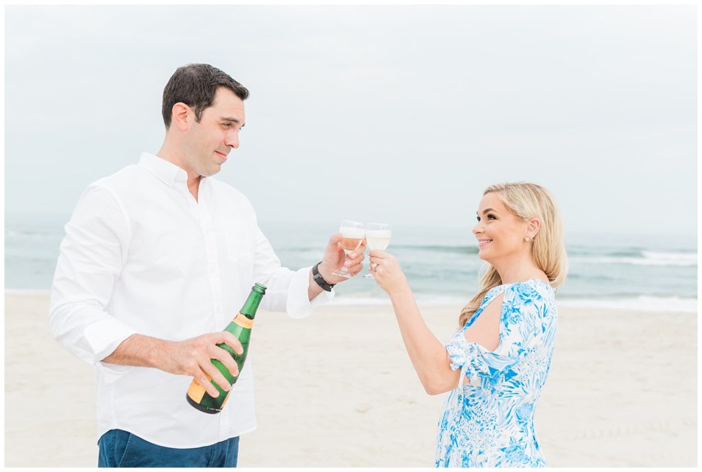 A couple enjoys a champagne picnic on the beach in Asbury Park, NJ.