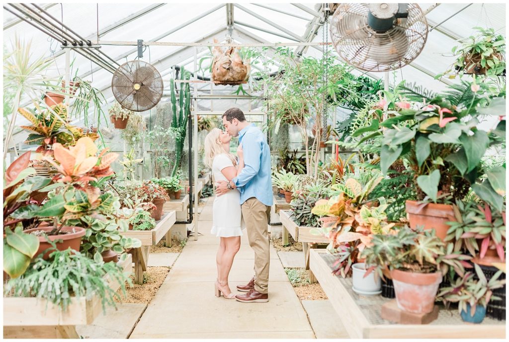 A couple kisses dances in a New Jersey greenhouse.