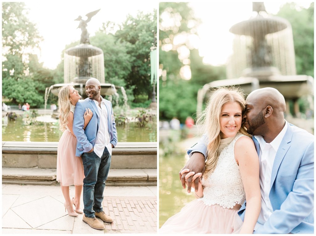 A man and woman pose for a photo in front of the Bethesda Fountain.
