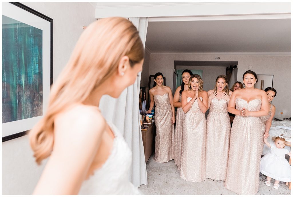 Bride shares a first look with her bridesmaids.