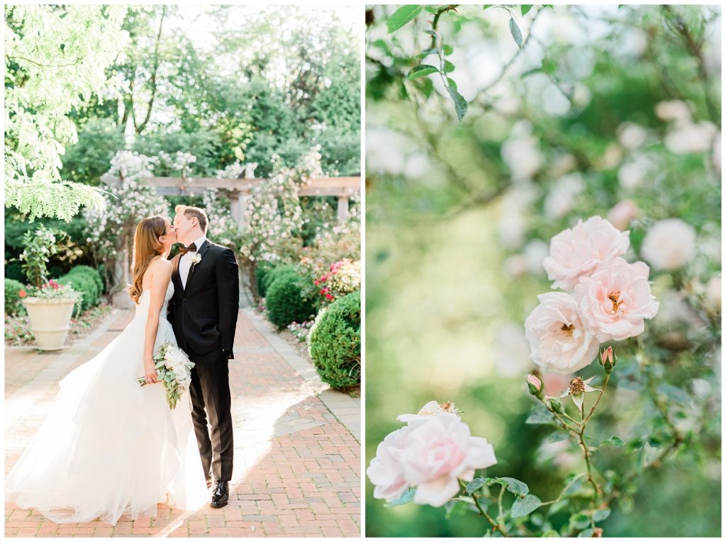 A bride and groom kiss in front of the rose garden at Florentine Gardens.