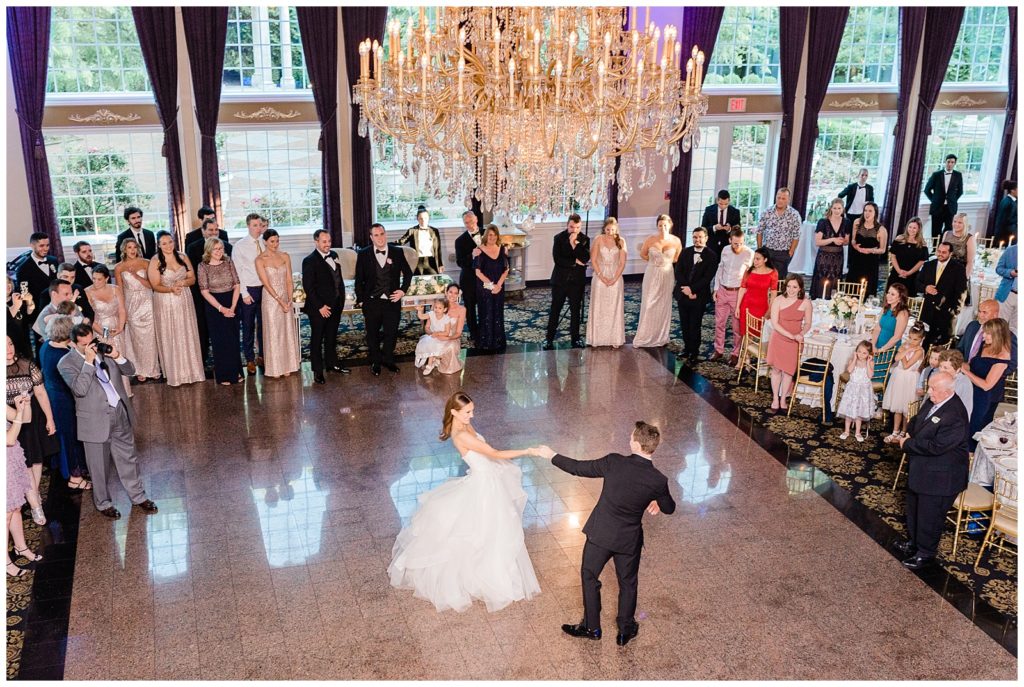 Bride and groom slow dance on the ballroom floor at the Estate at Florentine Gardens.