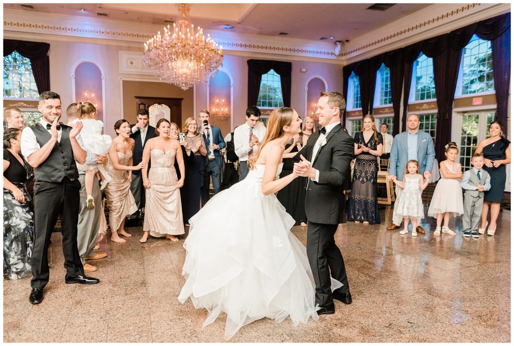 Bride and groom dance during their wedding reception at the Estate at Florentine Gardens.
