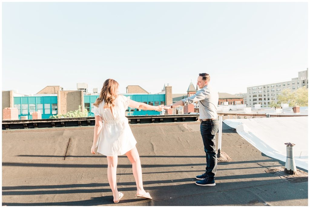 A couple slow dances on a rooftop in Hoboken.