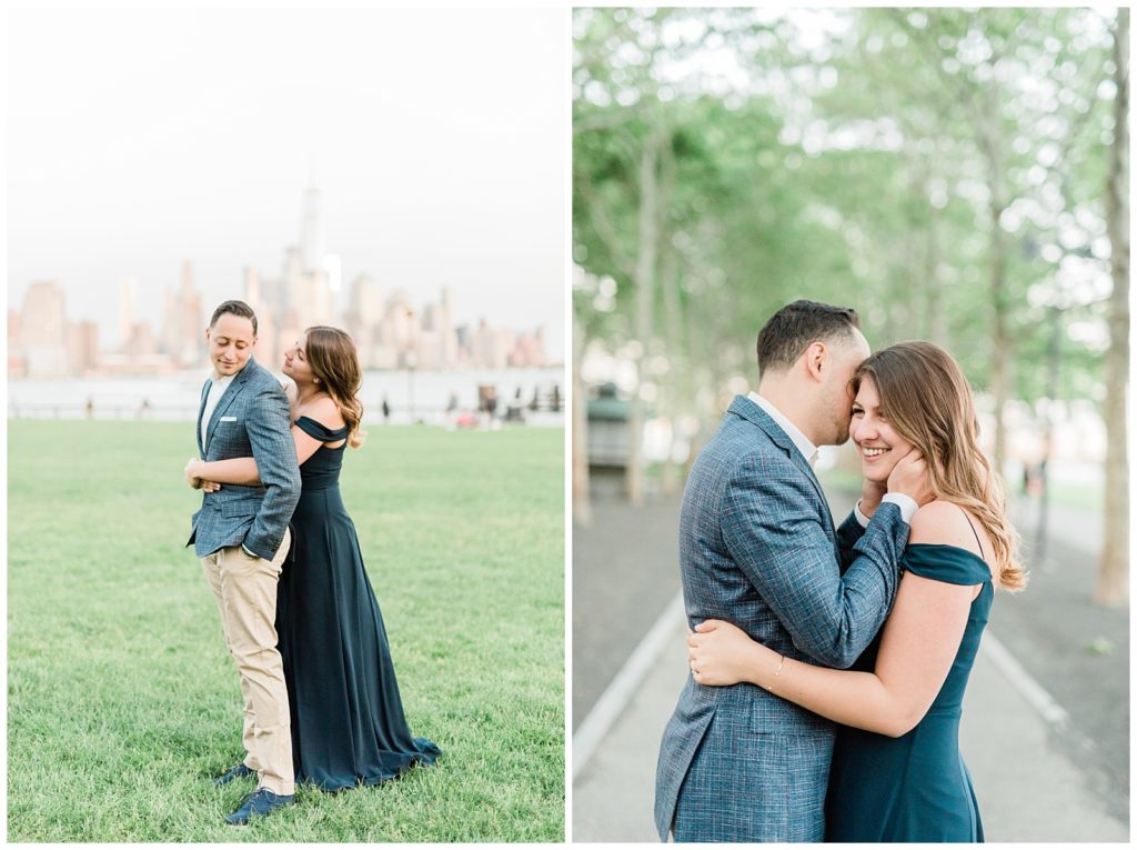 A woman hugs her fiance from behind by the Hoboken waterfront.