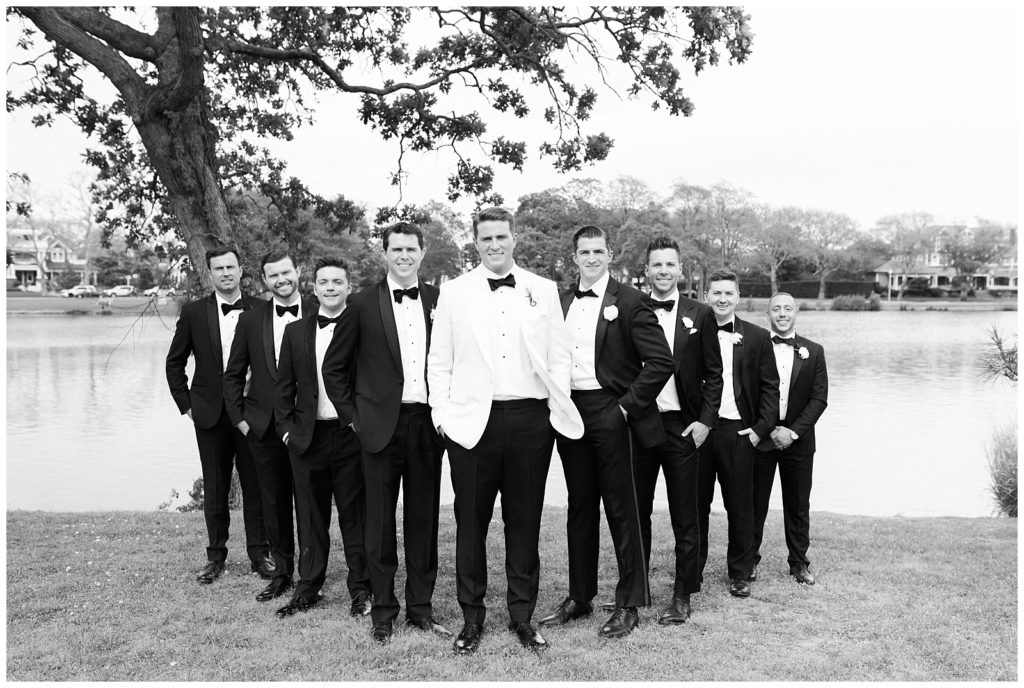 The groom poses for a photo with his groomsmen in Spring Lake NJ.