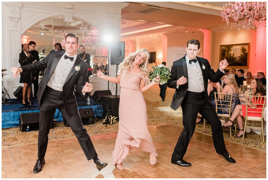 The best men and maid of honor make their grand entrance to the reception.