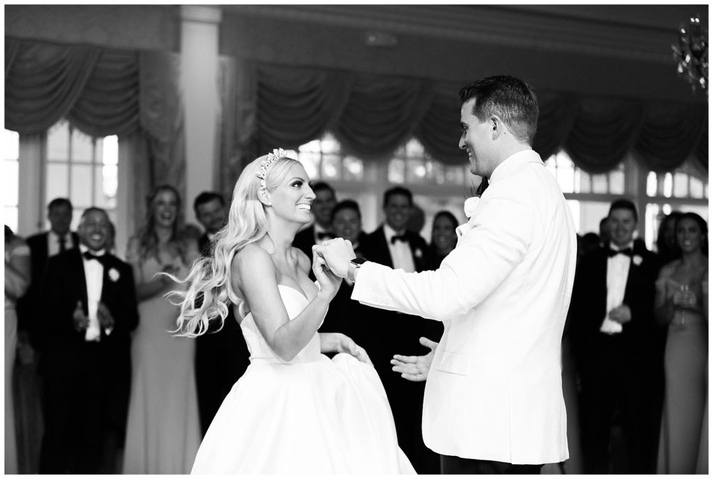 The bride and groom share their first dance.