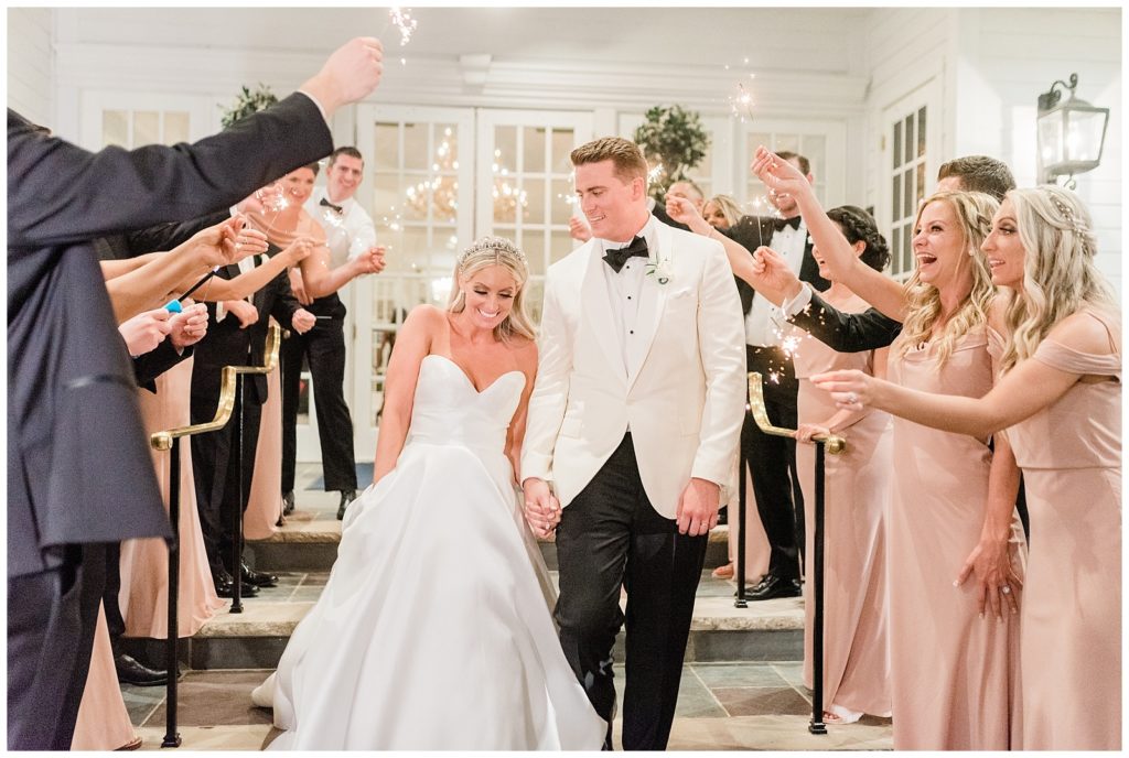 Bride and groom enjoy a celebratory sparkler exit from their reception.