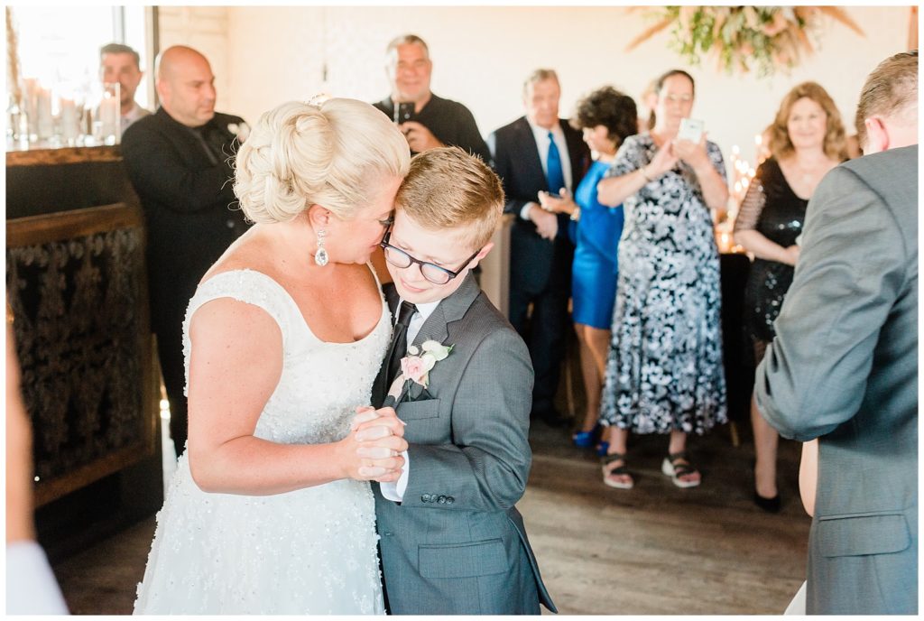 The bride dances with her son.