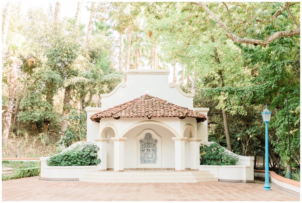 The white stucco and marble stage area of El Teatro overlooks the expansive courtyard area used for open-air wedding receptions at Rancho Las Lomas in Orange County, California.