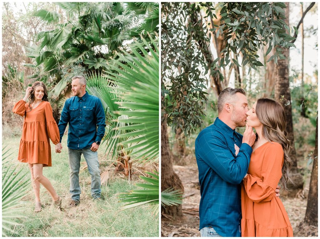 A couple kisses beneath the palm trees and eucalyptus trees in Fairmount Park in Riverside, California.